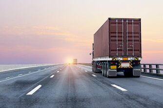 A truck drives off into the sunset A truck drives off into the sunset