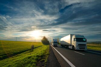 Trucks are driving on a country road Trucks are driving on a country road